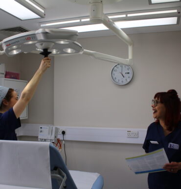 Two medical professionals in a clinic room