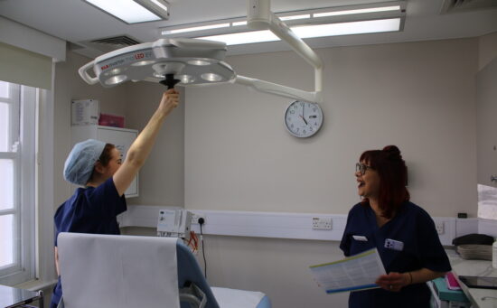 Two medical professionals in a clinic room