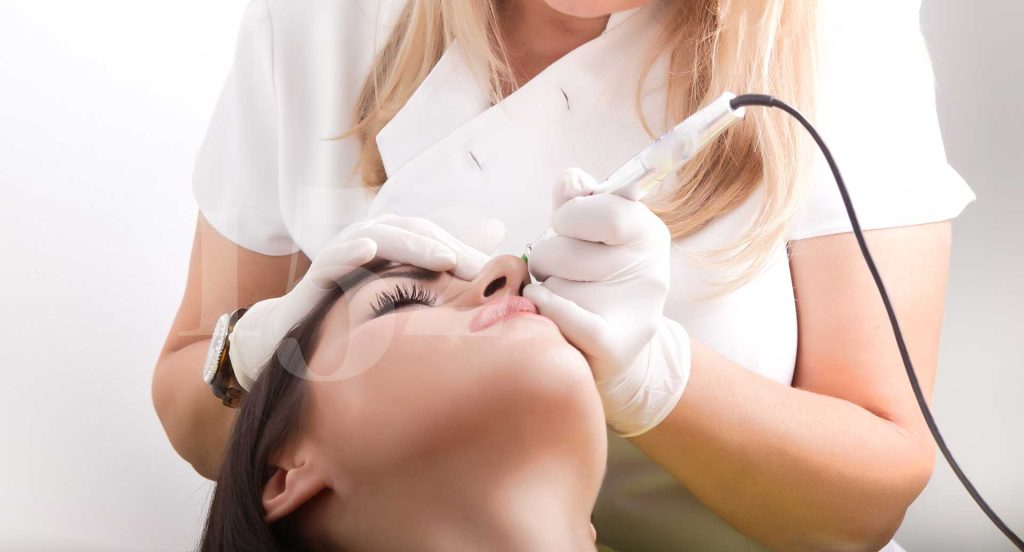 dr doing a medical tattoing procedure