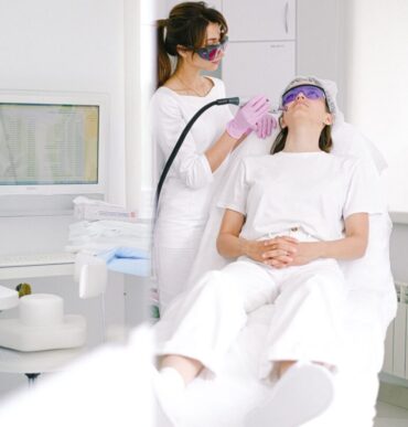 Doctor doing a laser treatment on the patient's face