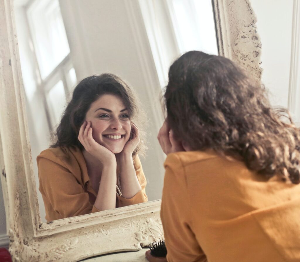 Woman looking at the mirror