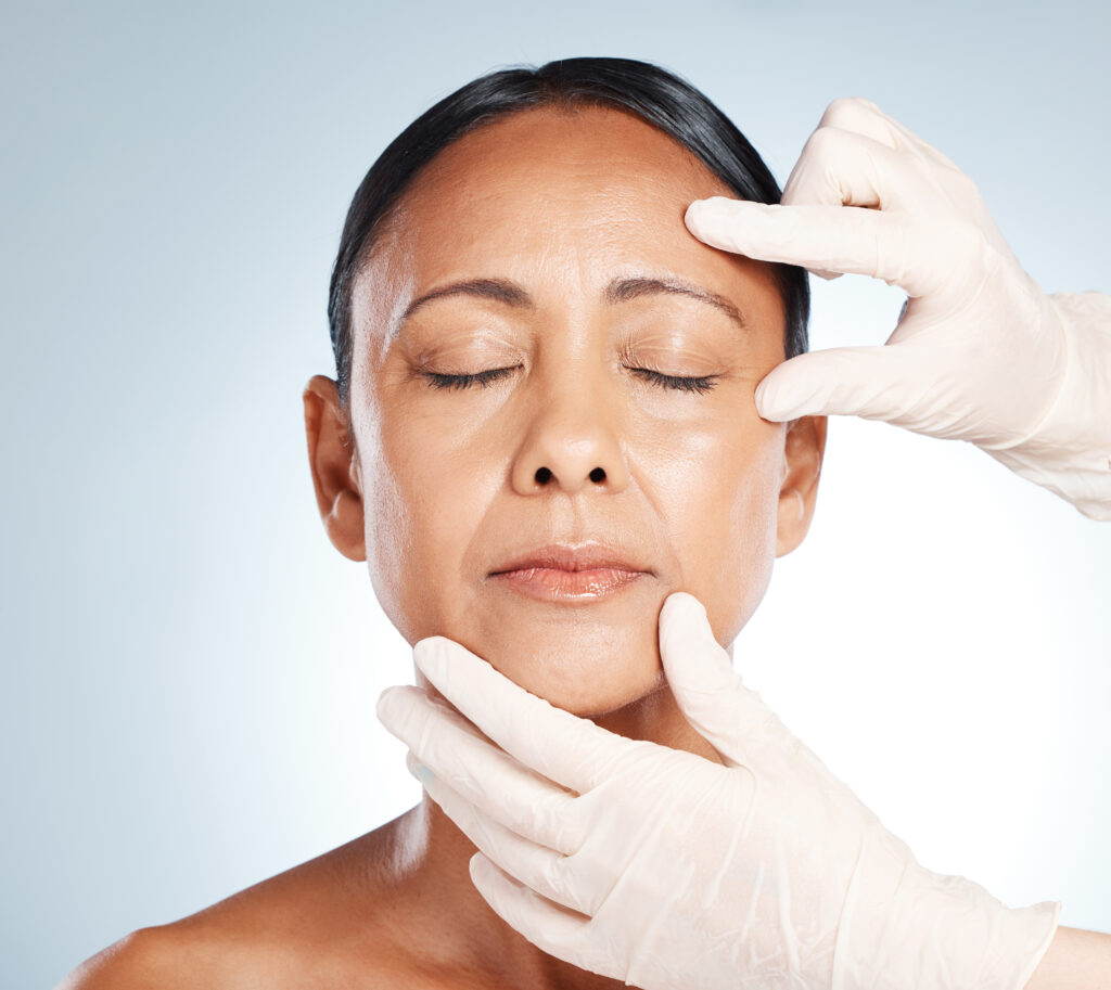 Botox, mature woman and doctor hands check face for plastic surgery and beauty consultation. Skincare, beauty and facial change for medical and aesthetic transformation with dermatology and filler.