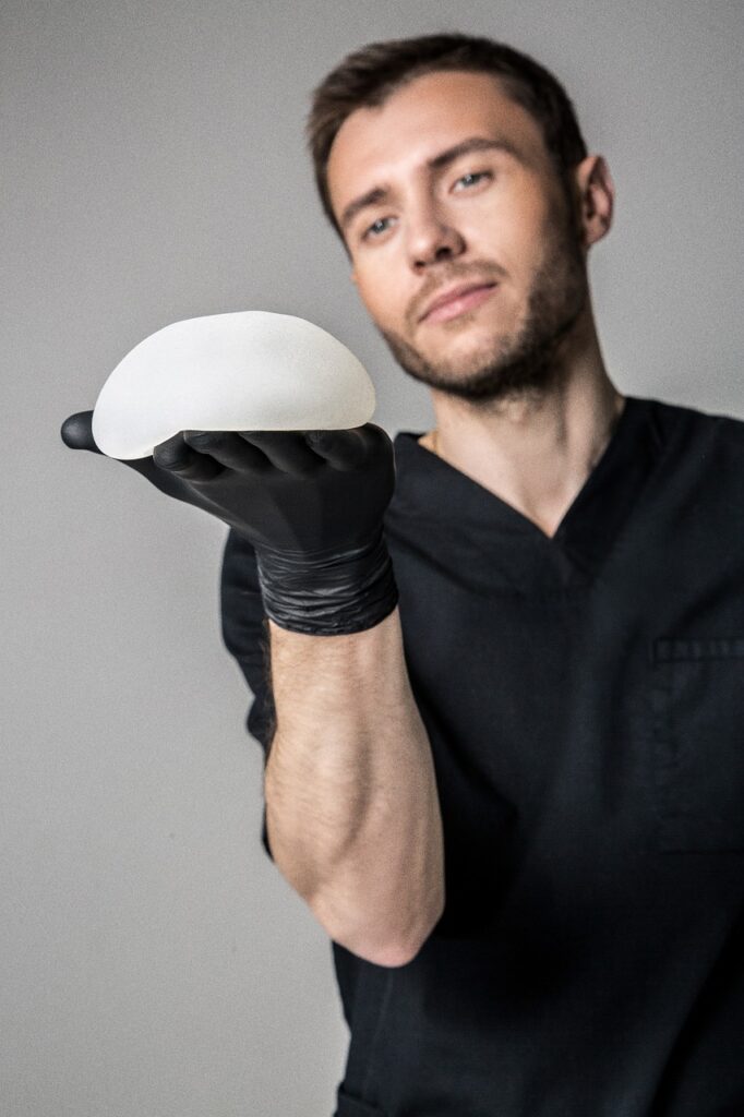 Man showing a silicon prosthesis